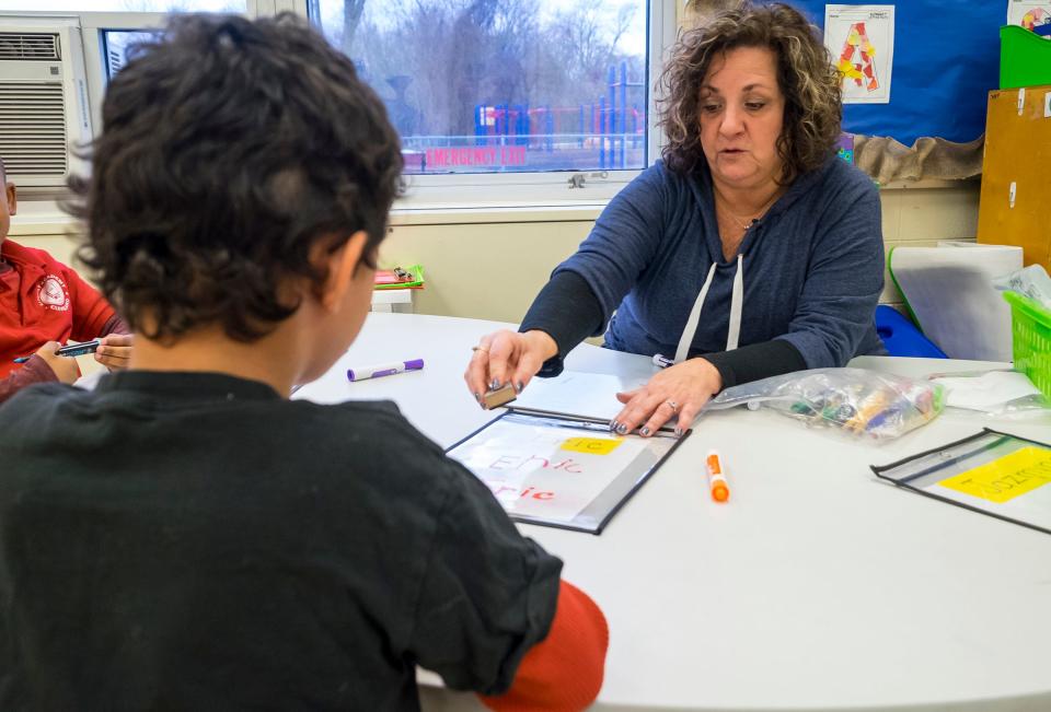 Sharon McComb, an intervention specialist at Literacy Academy at Cleveland Elementary, works with a student  Monday, Jan. 4, 2019 in the school's transitional kindergarten class.