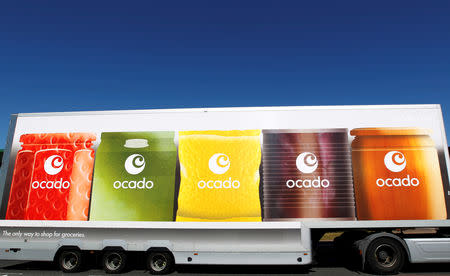 FILE PHOTO: An Ocado truck returns to the Ocado depot in Hatfield, southern England July 21, 2010. REUTERS/Suzanne Plunkett/File Photo