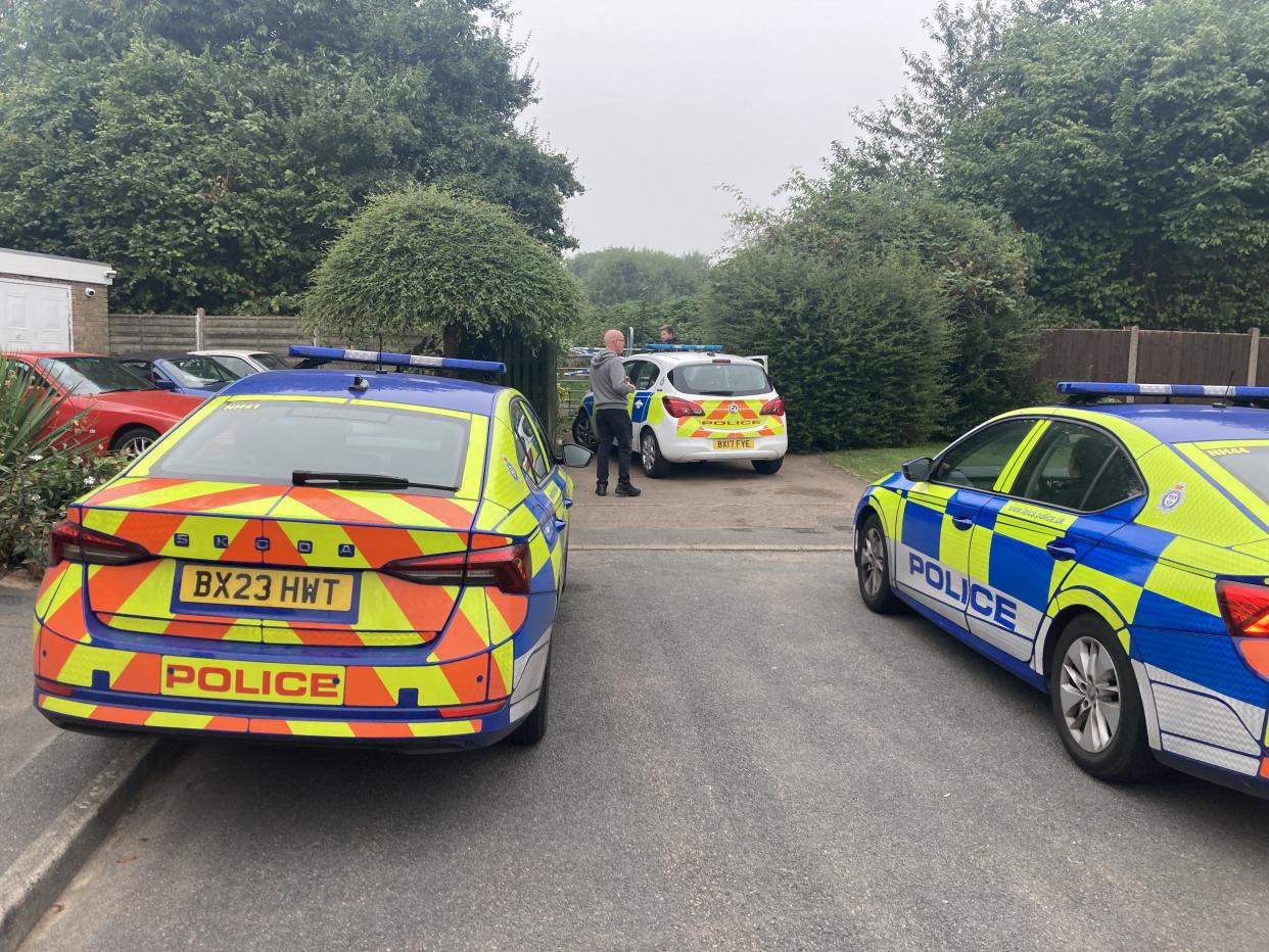 Police vehicles at an entrance to Franklin Park in Braunstone Town, Leicestershire, after an 80-year-old man was attacked. (Reach)