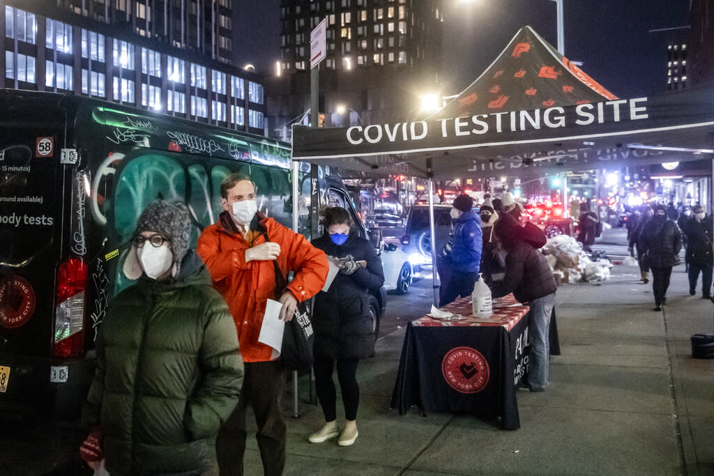 People wait on line to get tested for COVID-19 in New York City. More than a year after the vaccine was rolled out, new cases of COVID-19 in the U.S. have soared to the highest level on record at over 265,000 per day on average. (AP Photo/Brittainy Newman)