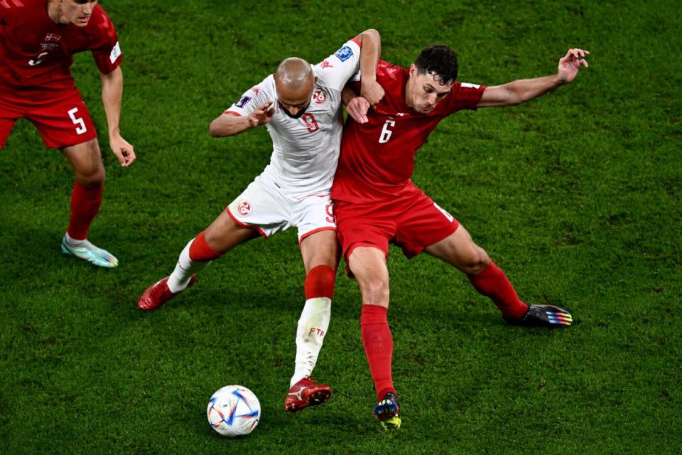 Andreas Christensen (right) vies with Issam Jebali of Tunisia (AFP via Getty Images)