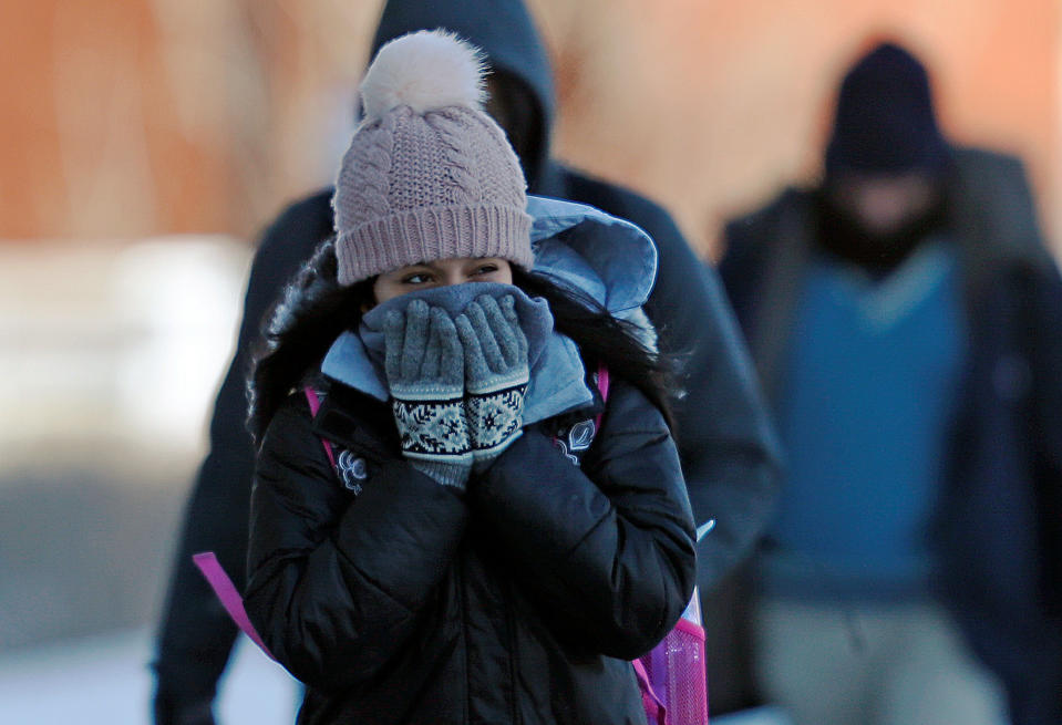 A student reacts to subzero temperatures while walking to class at the University of Minnesota in Minneapolis, Minn., Jan. 29, 2019. (Photo: Eric Miller/Reuters)