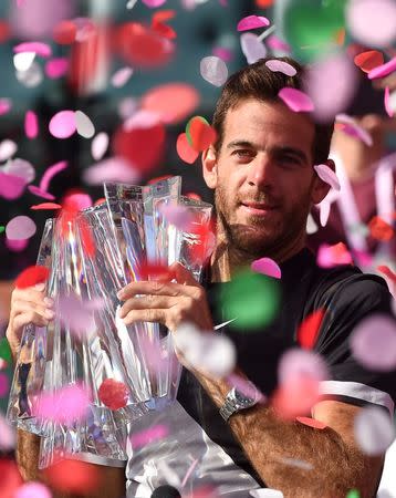 Mar 18, 2018; Indian Wells, CA, USA; Juan Martin Del Potro holds the championship trophy after defeating Roger Federer (not pictured) in the men's finals in the BNP Paribas Open at the Indian Wells Tennis Garden. Mandatory Credit: Jayne Kamin-Oncea-USA TODAY Sports