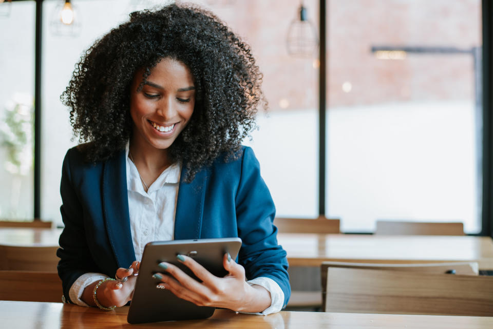 a woman working on an ipad