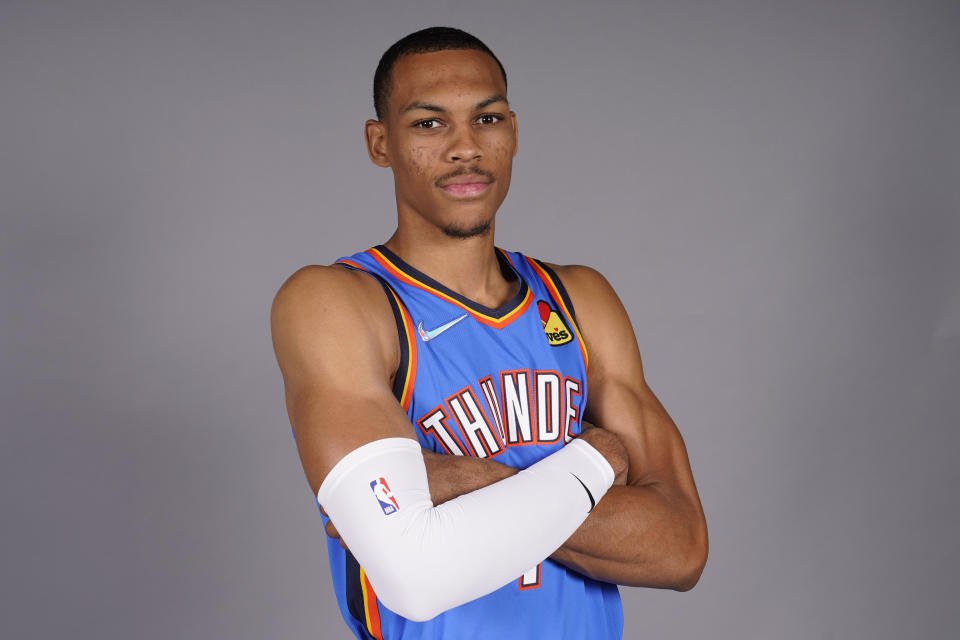 FILE - Oklahoma City Thunder's Darius Bazley poses for a picture during the NBA basketball team's Media Day, Monday, Sept. 27, 2021, in Oklahoma City. After high school, Bazley skipped college and took a $1 million internship with New Balance for a year before jumping into the NBA. He was the 23rd pick in the 2019 draft and now, he's a starter for the Oklahoma City Thunder. (AP Photo/Sue Ogrocki, File)