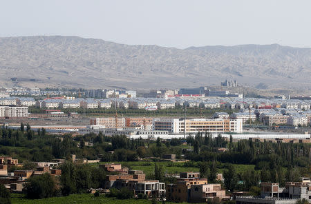 FILE PHOTO: With Xinjiang’s fabled Tianshan mountains in the background, what is officially known as a vocational skills education centre is seen in Turpan in Xinjiang Uighur Autonomous Region, China September 5, 2018. REUTERS/Thomas Peter