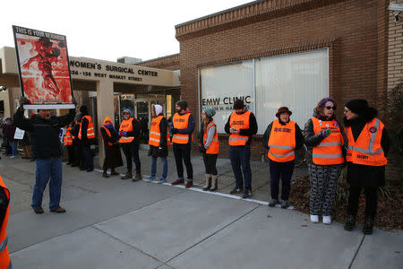 Protesters and escorts who ensure women can reach the clinic face off outside the EMW WomenÕs Surgical Center in Louisville, Kentucky, U.S. January 27, 2017. REUTERS/Chris Kenning