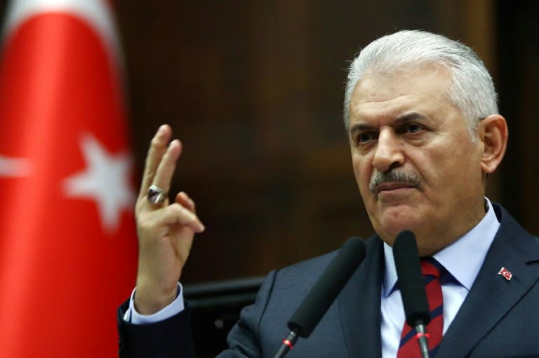 Turkish Prime Minister and leader of Turkey's ruling Justice and Development Party (AKP) Binali Yildirim addresses the AKP group meeting at the Grand National Assembly of Turkey in Ankara, on November 29, 2016