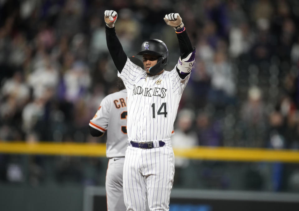 Colorado Rockies' Ezequiel Tovar gestures to the dugout after reaching second base after an RBI single off San Francisco Giants starting pitcher Logan Webb during the eighth inning of a baseball game Friday, Sept. 15, 2023, in Denver. (AP Photo/David Zalubowski)