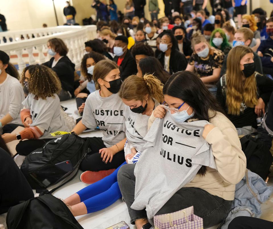 Justice for Julius shirts are handed out Wednesday to students participating in a walk out from school and a march to the Capitol to take part of the vigil for Julius Jones.