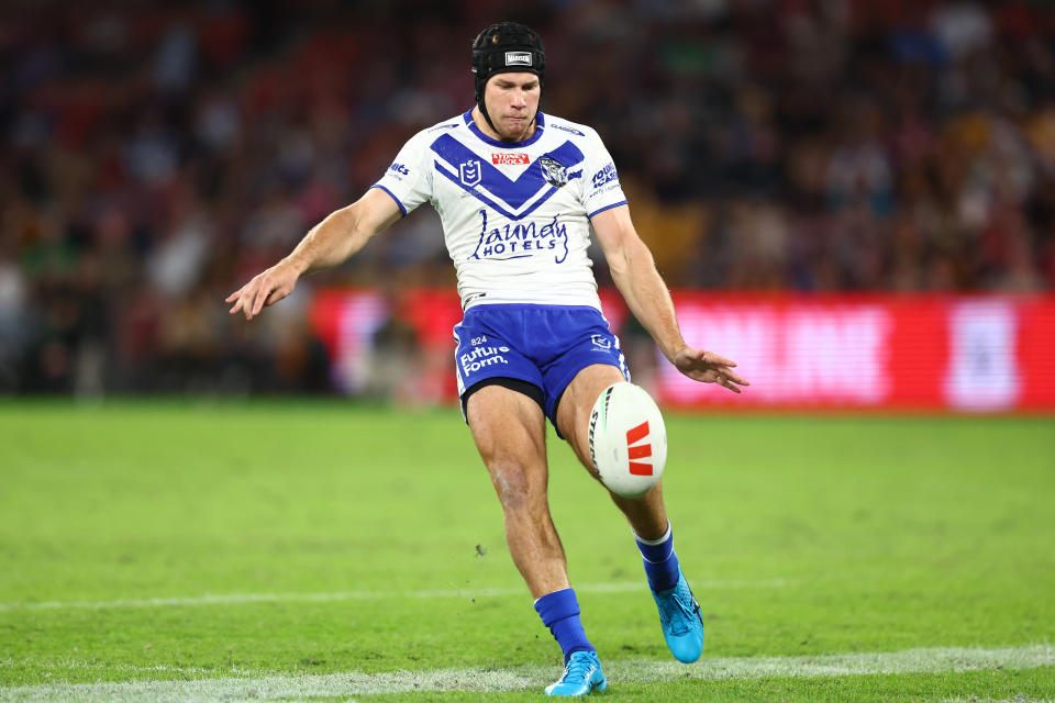 BRISBANE, AUSTRALIA - MAY 05:  Matt Burton of the Bulldogs kicks the ball during the round 10 NRL match between Canterbury Bulldogs and Canberra Raiders at Suncorp Stadium on May 05, 2023 in Brisbane, Australia. (Photo by Chris Hyde/Getty Images)