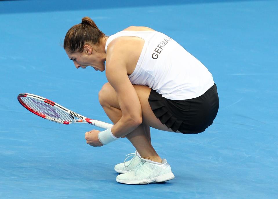 Andrea Petkovic of Germany reacts after winning 6-1, 7-6, in her semifinal match against Samantha Stosur of Australia during the Fed Cup semifinals between Australia and Germany in Brisbane, Australia, Saturday, April 19, 2014. (AP Photo/Tertius Pickard)