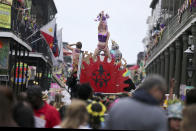 A woman dances atop a makeshift float on Bourbon Street on Mardi Gras day in New Orleans, Tuesday, Feb. 25, 2020. (AP Photo/Rusty Costanza)