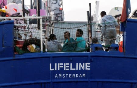 Migrants are seen on the deck of the Mission Lifeline rescue boat in the central Mediterranean Sea, June 21, 2018. Hermine Poschmann/Misson-Lifeline/Handout via REUTERS