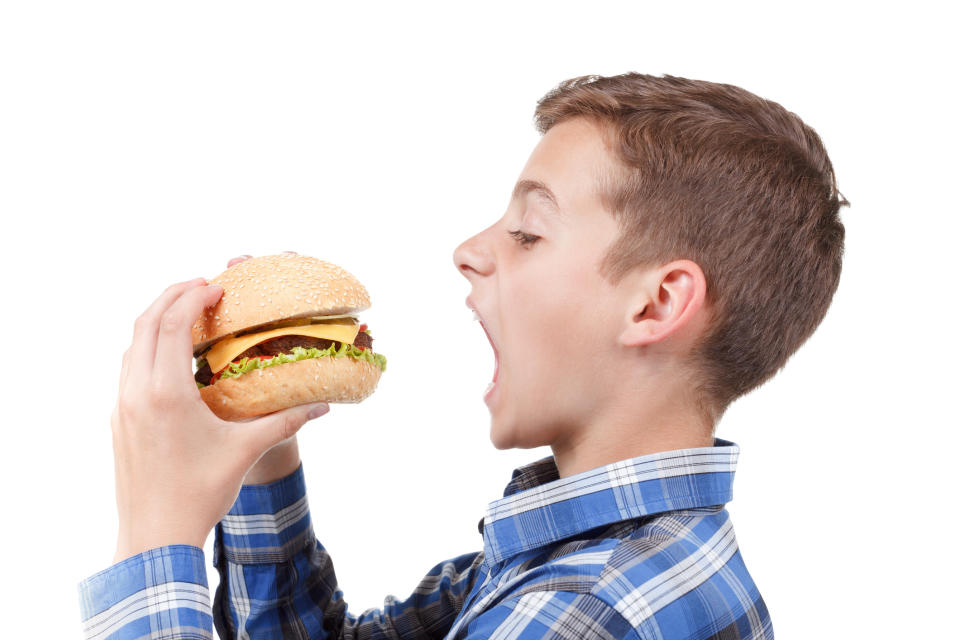 Boy ready to take big bite out of burger