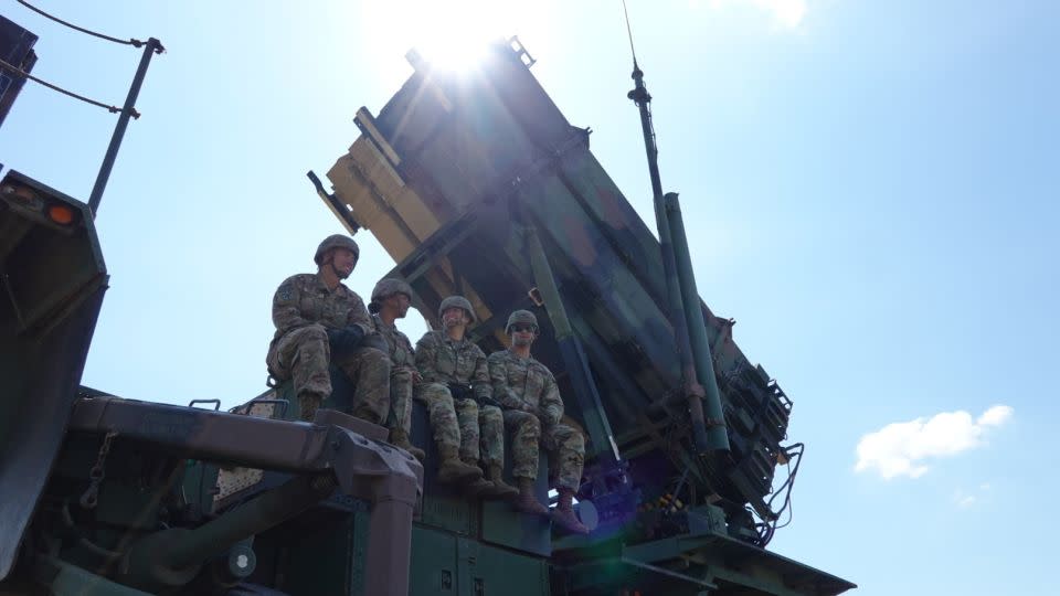 Servicemembers assinged to Bravo Battery, 5th Battalion, 7th Air Defense Artillery, 10th Army Air Missile Defense Command, rest on a Patriot missile launcher on Aug. 9 in Slovakia.  - 2nd Lt. Emily Park/U.S. Department of Defense