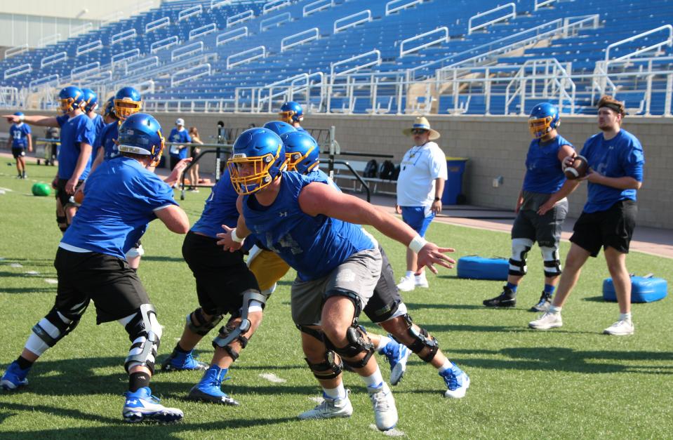 Offensive tackle Garret Greenfield looks for someone to block during a drill at South Dakota State's first practice of the season, Friday at Dana J. Dykhouse Stadium.