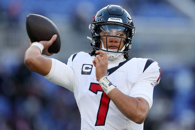 <p>Rob Carr/Getty</p> C.J. Stroud of the Houston Texans warms up prior to the AFC Divisional Playoff game against the Baltimore Ravens at M&T Bank Stadium on Jan. 20, 2024 in Baltimore, Maryland.