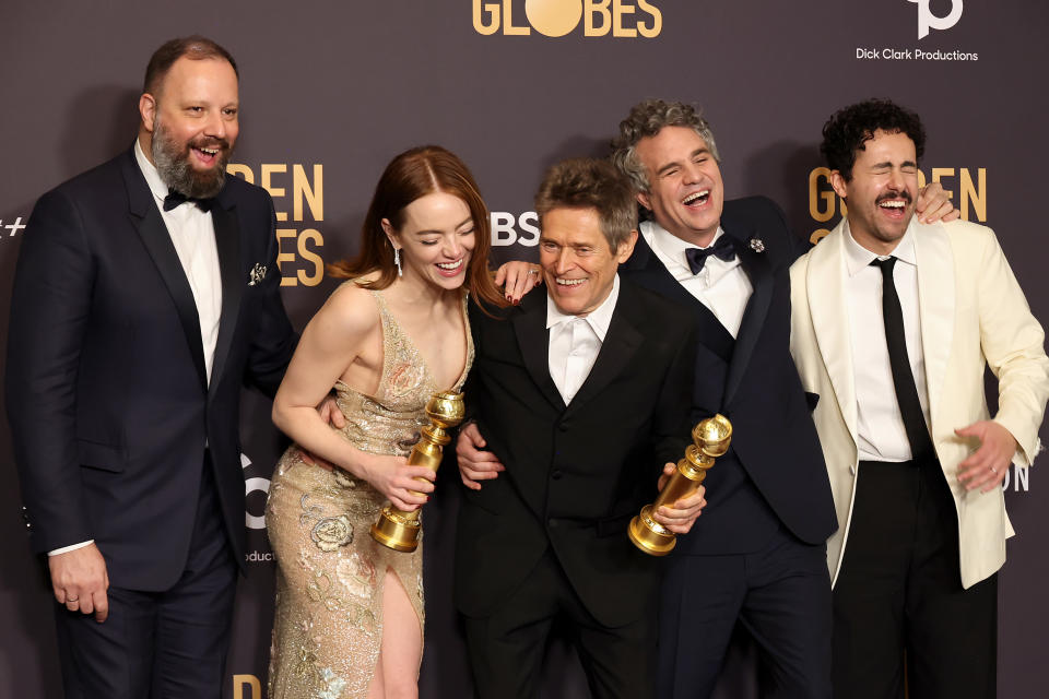 Director Yorgos Lanthimos, Emma Stone, Willem Dafoe, Mark Ruffalo and Ramy Youssef celebrate 'Pour Creatures' win for Best Motion Picture, Comedy or Musical at the Golden Globes.  (Photo by Amy Sussman/Getty Images)