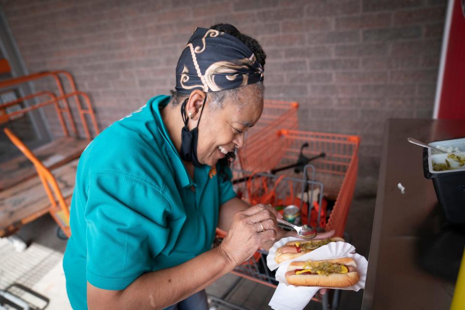 Home Depot employee Marion Nelson is happy that the hot dog stand at the Madison Heights Home Depot on 12 Mile is serving up dogs again in a new built-in stand on Monday, Sept. 11, 2023.