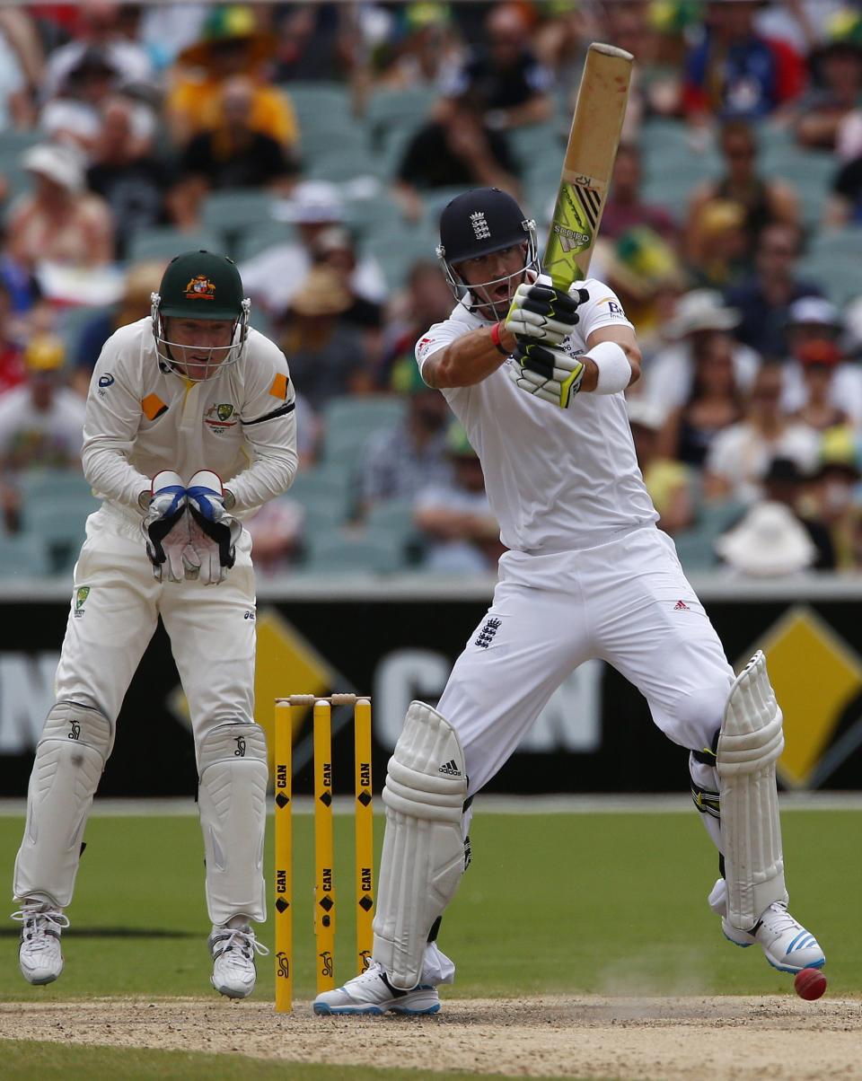 England's Kevin Pietersen (R) plays a shot next to Australia's Brad Haddin during the fourth day's play in the second Ashes cricket test at the Adelaide Oval December 8, 2013.