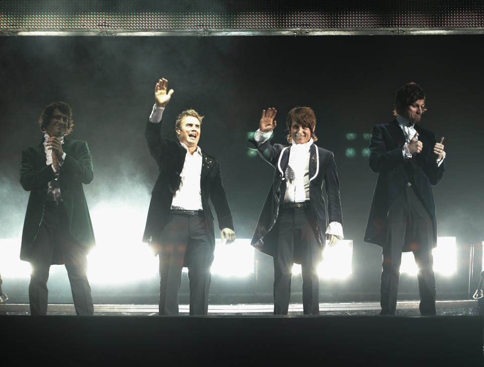 Howard Donald, Gary Barlow, Mark Owen and Jason Orange of Take That perform onstage on their Ultimate Tour at the Sheffield Arena May 2, 2006 in London, England. (Photo by Jo Hale/Getty Images)