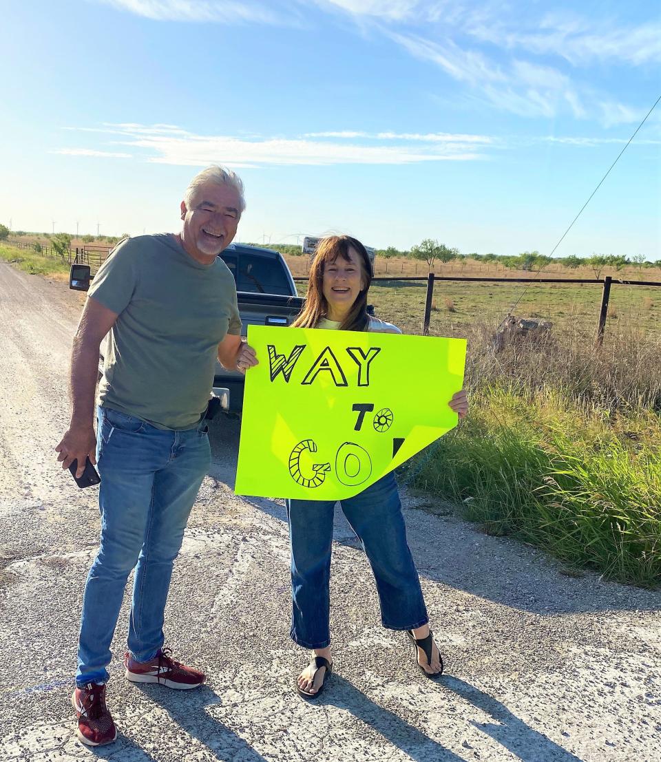 Two well-wishers cheered Bob Green and those cycling with him on Leg 4 of Saturday's fundraiser for Meals on Wheels. Green, who is 80, rode 80 miles.