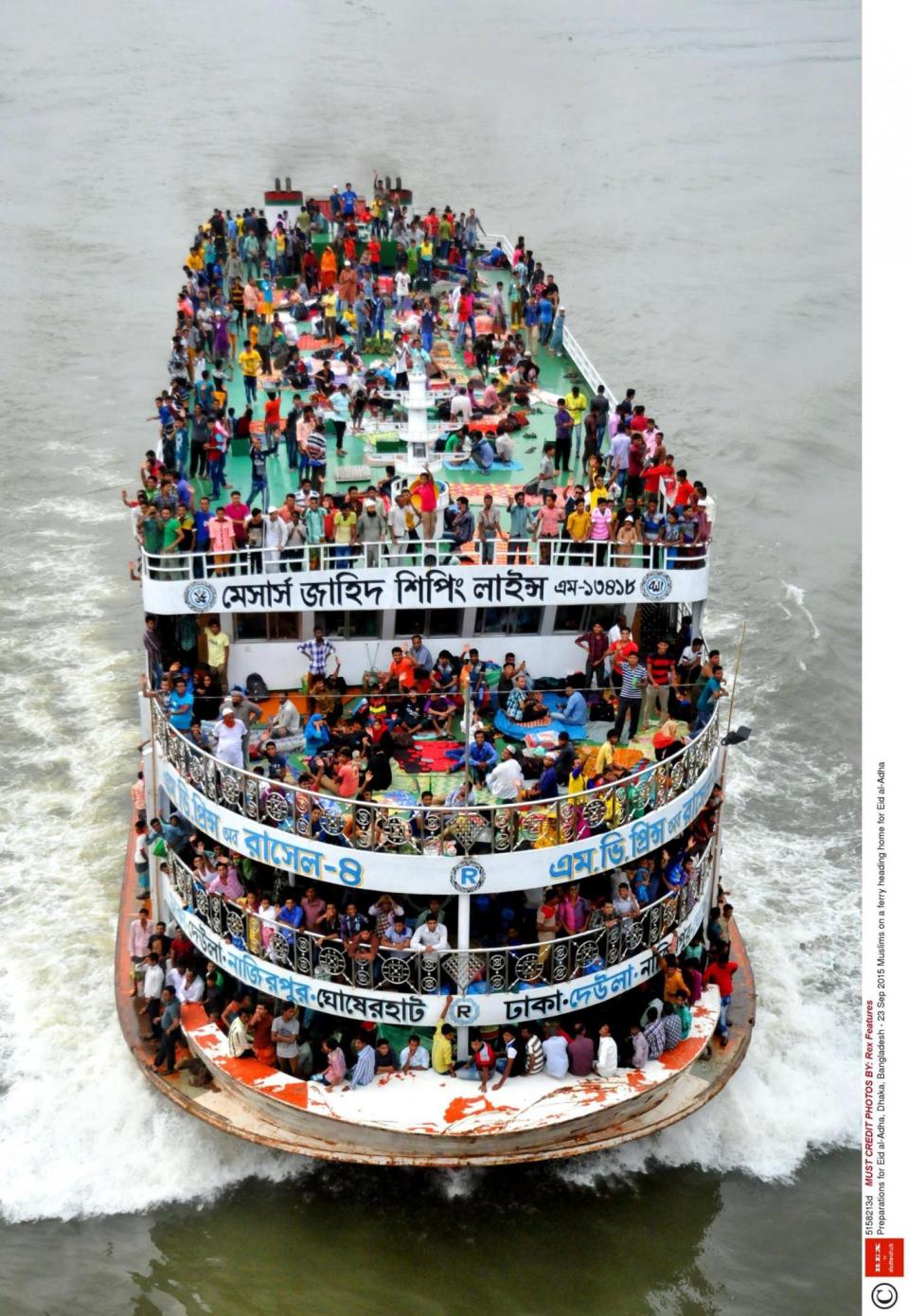 Bangladeshi Muslims travel home for celebrations on a crowded ferry in Dhaka (Rex Features / Sony Ramany)