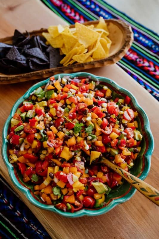 <p>Muy Bueno Cookbook</p><p>This budget-minded dish is chock-full of colorful veggies and black beans, dressed with a tangy, spicy homemade dressing. Whether you call it Texas Caviar or Cowboy Caviar, it is perfect as a side dish or an appetizer served with tortilla chips.</p><p><strong>Get the Recipe: </strong><a href="https://muybuenocookbook.com/cowboy-caviar" rel="nofollow noopener" target="_blank" data-ylk="slk:Texas Caviar;elm:context_link;itc:0;sec:content-canvas" class="link "><strong>Texas Caviar</strong></a></p>