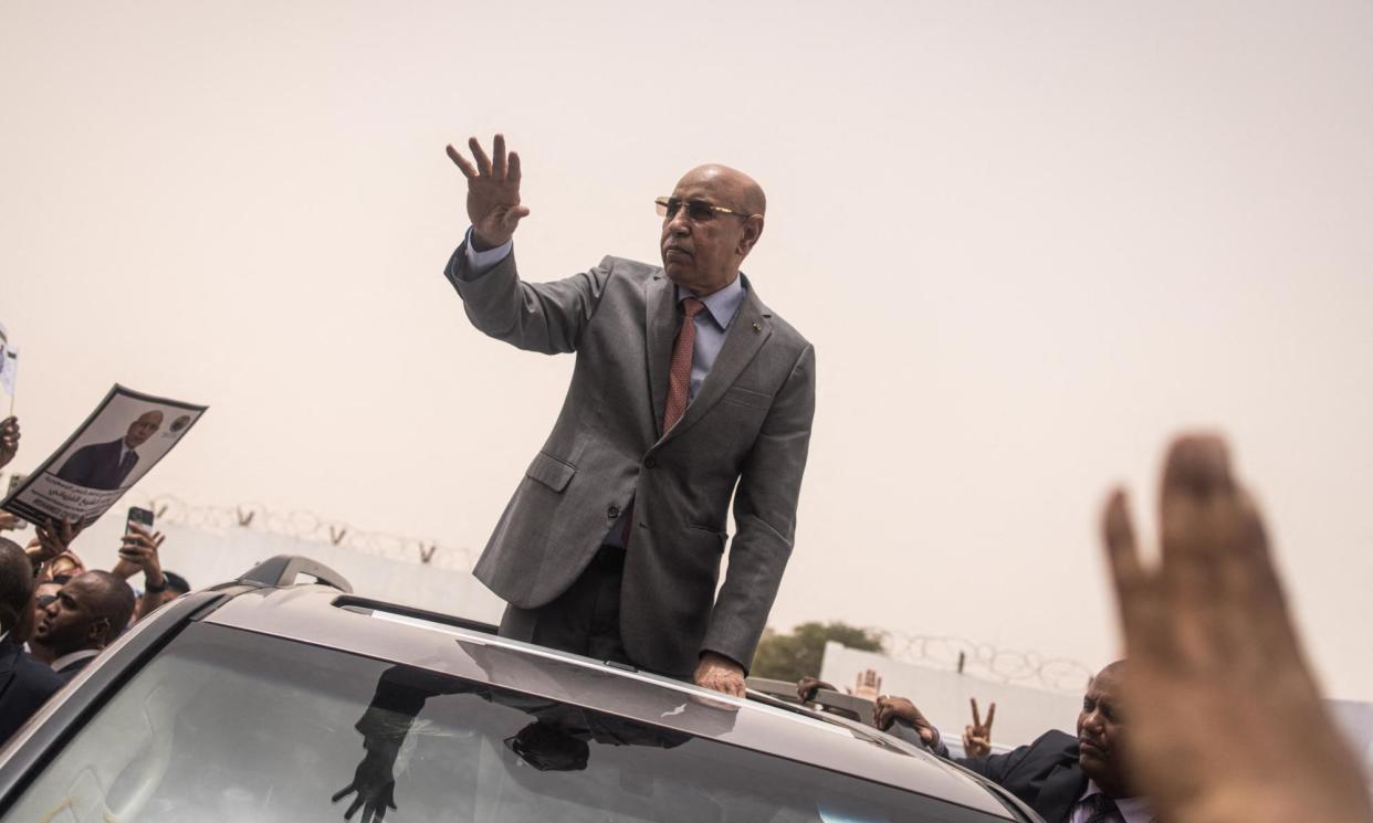 <span>Mohamed Ould Ghazouani celebrating his re-election on Monday. His rival rejected the results over alleged irregularities and called for ‘peaceful demonstrations’.</span><span>Photograph: John Wessels/AFP/Getty Images</span>