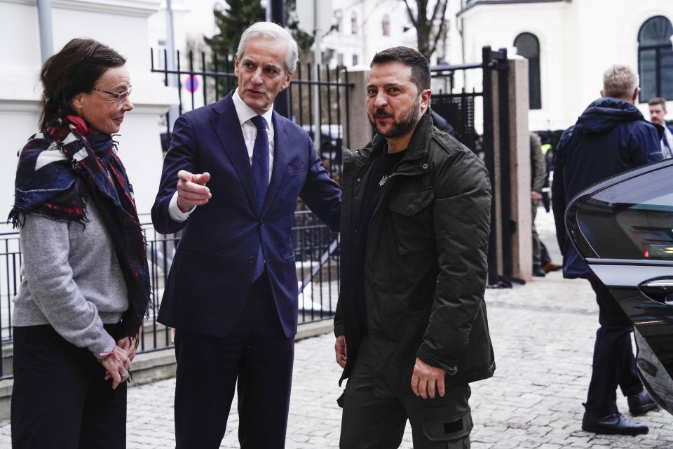 Ukrainian President Volodymyr Zelenskyy, right, is received by Norway's Prime Minister Jonas Gahr Støre at the government's representative residence in Oslo, Wednesday, Dec. 13, 2023. (Cornelius Poppe/NTB Scanpix via AP)