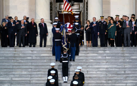 The casket carrying former president George Herbert Walker Bush is carried up the steps of the US Capitol in Washington, Monday, Nov. 3, 2018. President Bush who died at the age 94, will lie in state in the Capitol Rotunda until Wednesday morning. Doug Mills/Pool via REUTERS