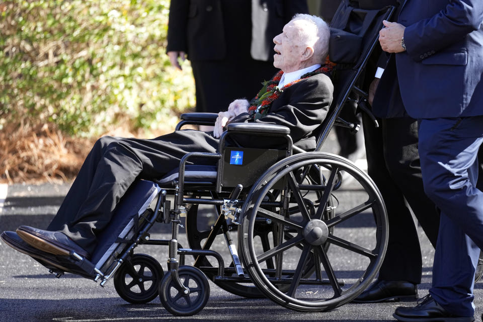 Former President Jimmy Carter departs after attending the funeral service for his wife, former first lady Rosalynn Carter, at Maranatha Baptist Church, in Plains, Ga., Wednesday, Nov. 29, 2023. The former president, now 99 and in hospice care, sat in a wheelchair next to Maranatha’s front pew, wearing a dark suit and tie to say goodbye to his wife of 77 years. (AP Photo/John Bazemore)
