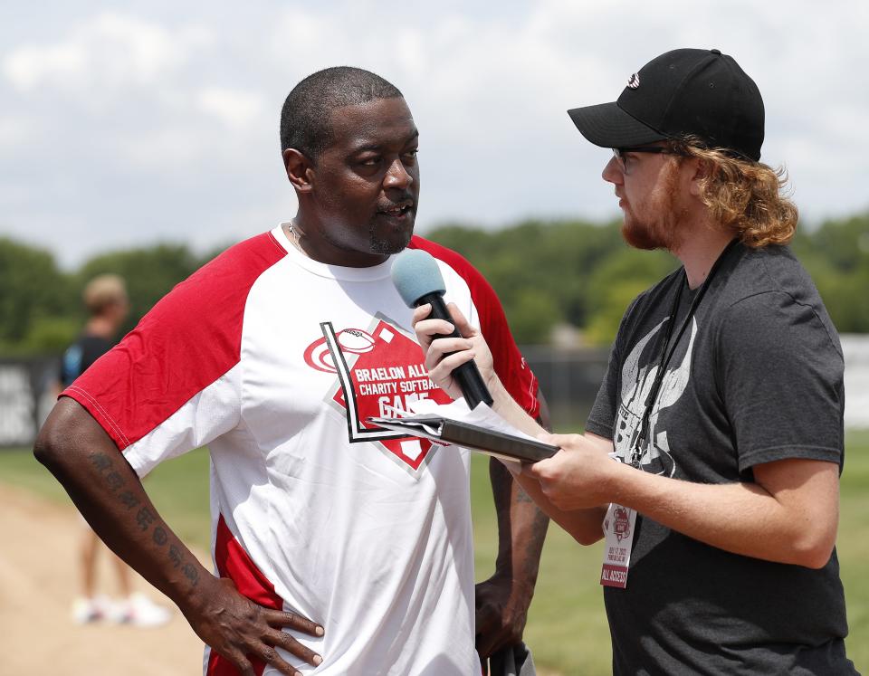 Heisman Trophy wnner and Wisconsin Badgers legend Ron Dayne being interviewed during the Braelon Allen Charity Softball Game on Sunday, July 17, 2022, in Fond du Lac, Wis.
