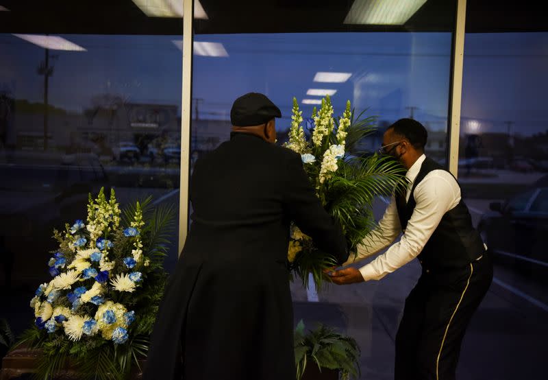 The Wider Image: 'I just ask God to help me': Texas funeral home crushed by death as U.S. COVID toll nears 500,000