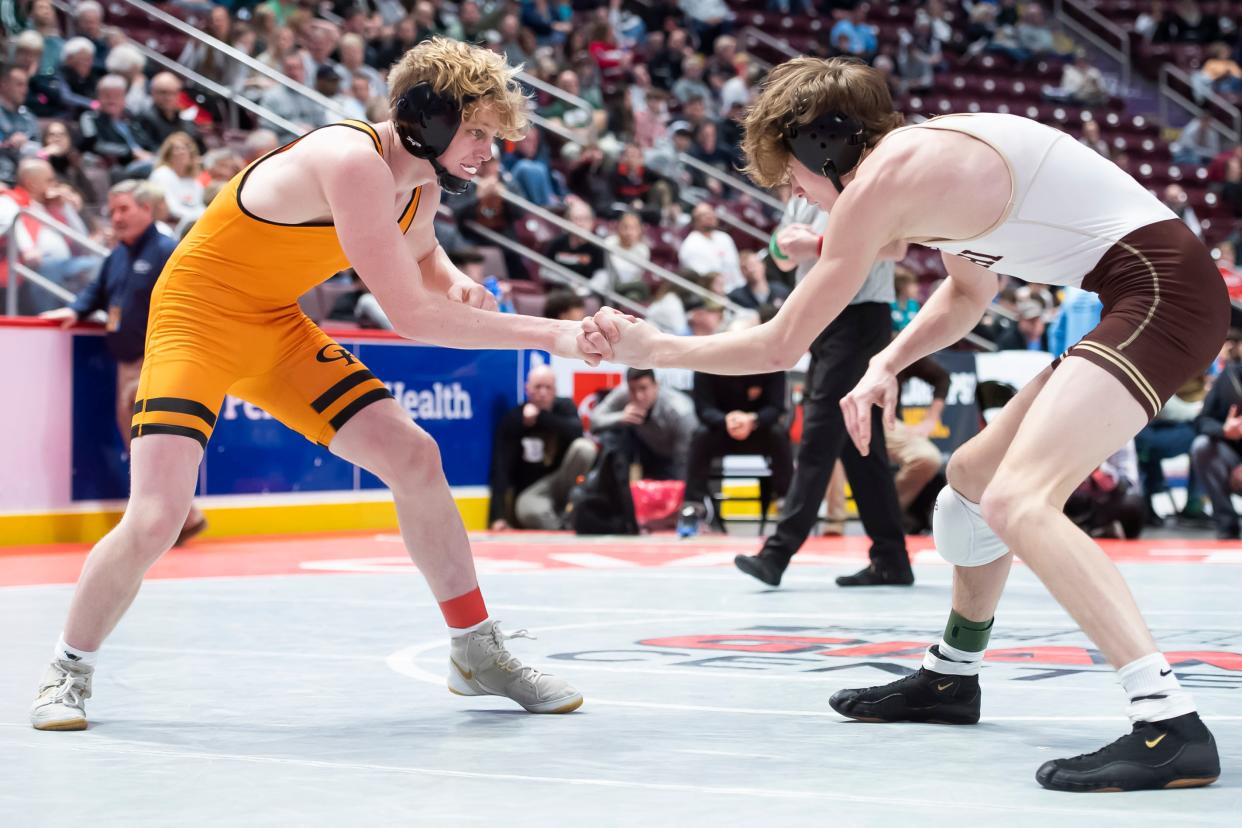 Cathedral Prep's Jake Van Dee, left, locks hands with Bethlehem Catholic's Dante Frinzi during a 126-pound round of 16 bout at the PIAA Class 3A Wrestling Championships at the Giant Center on Thursday, March 10, 2022, in Derry Township. Van Dee won by decision, 2-1.