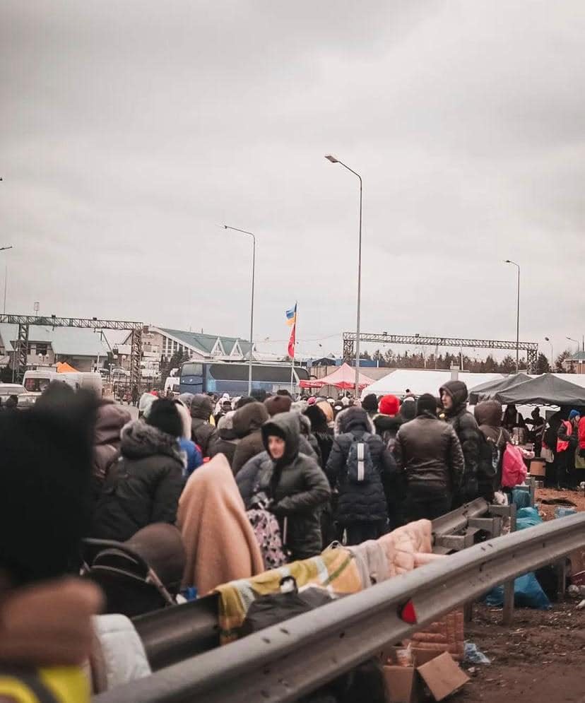 Fleeing refugees from Ukraine gather at the Poland/Ukraine border.