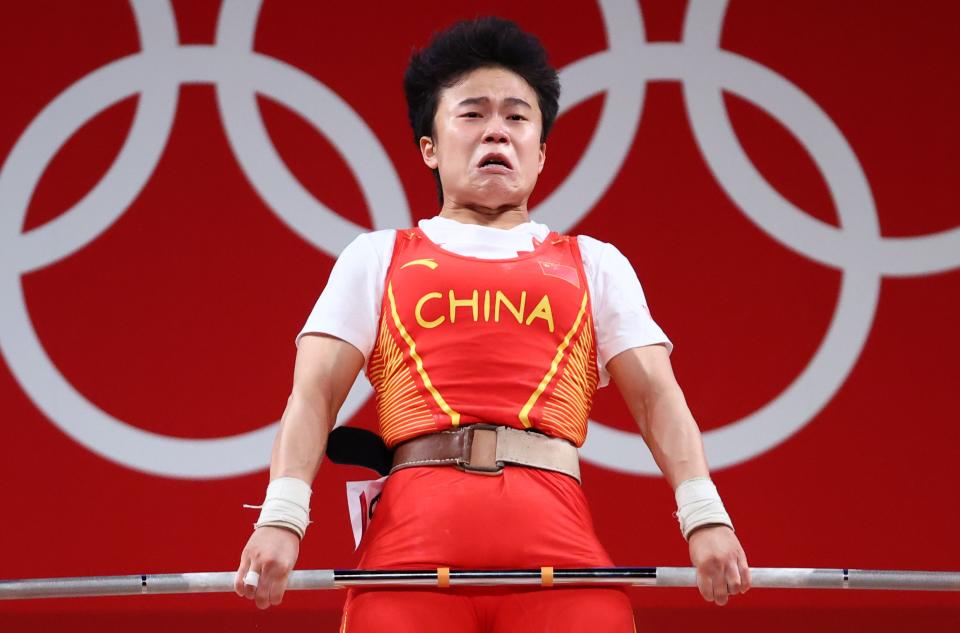 Tokyo 2020 Olympics - Weightlifting - Women's 49kg - Group A - Tokyo International Forum, Tokyo, Japan - July 24, 2021.  Hou Zhihui of China in action. REUTERS/Edgard Garrido