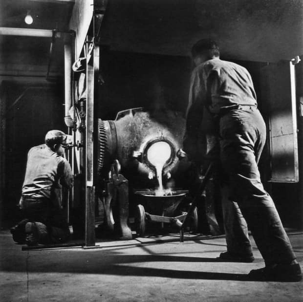 Workers pour a gold brick using a bullion furnace in Giant Mine, in 1952. The unique deposits of gold required that the ore be roasted at extremely high temperatures. 'Unfortunately, this roasting process also released arsenic rich gas, a highly toxic by-product,' according to a federal site on the history of Giant Mine.  