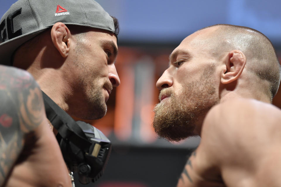 ABU DHABI, UNITED ARAB EMIRATES - JANUARY 22: (L-R) Opponents Dustin Poirier and Conor McGregor of Ireland face off during the UFC 257 weigh-in at Etihad Arena on UFC Fight Island on January 22, 2021 in Abu Dhabi, United Arab Emirates. (Photo by Chris Unger/Zuffa LLC)