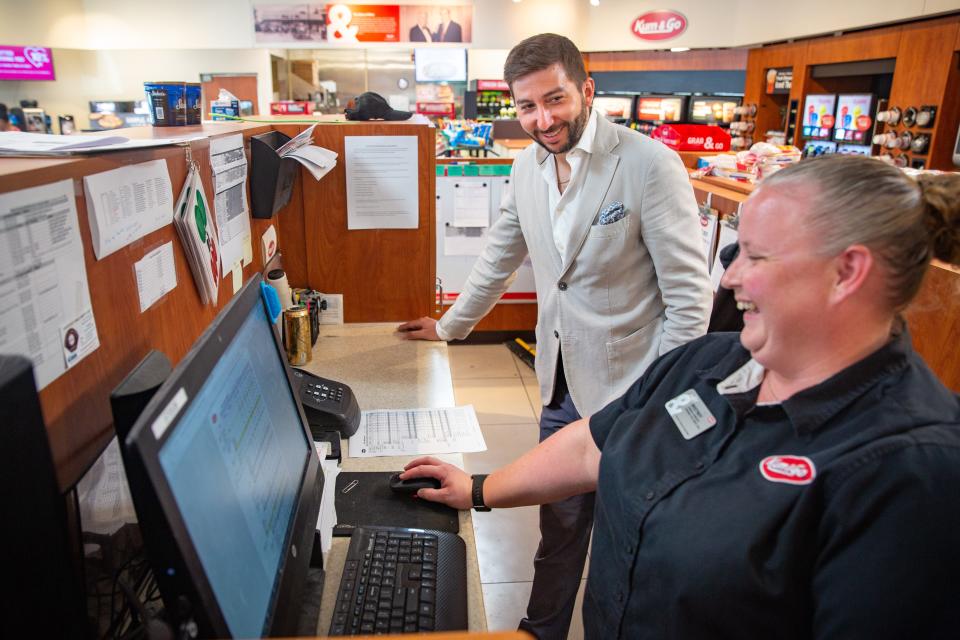 Kum & Go CEO Tanner Krause talks with store manager Whitney Wickham.