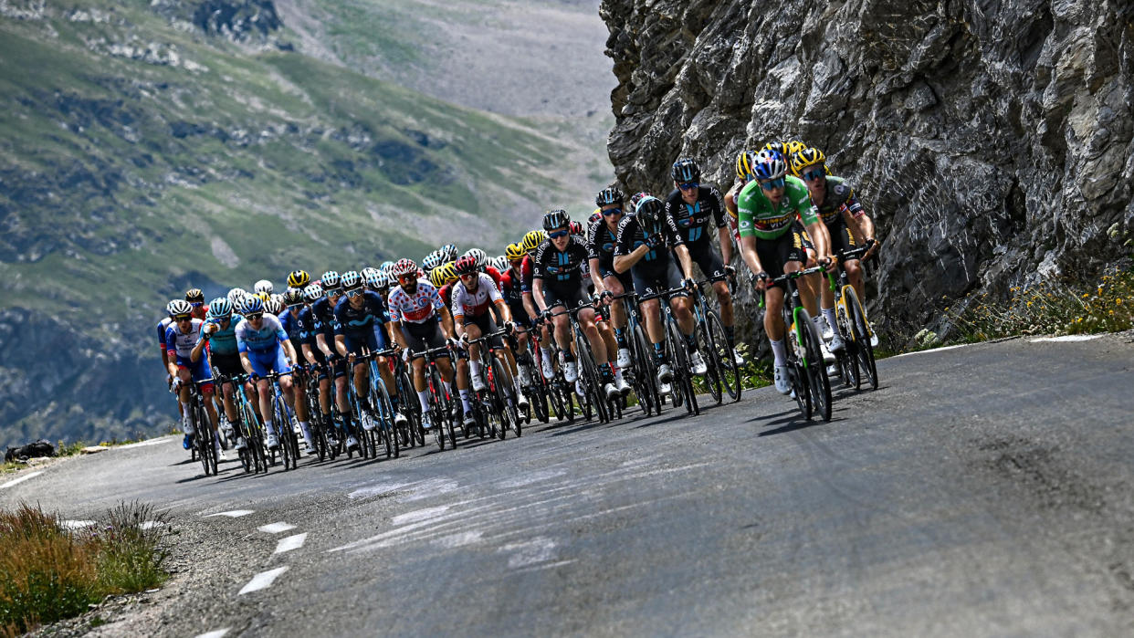  The peleton climbs a steep mountain road 