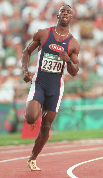 Michael Johnson of the US wins the qualifying round 2 in the men's 400m Olympic athletics event at the Olympic Stadium in Atlanta, Georgia, 27 July. Johnson finished with a time of 44.62. (FOR EDITORIAL USE ONLY) AFP-IOPP/Eric FEFERBERG