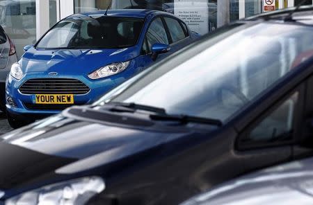 A new car is displayed on the forecourt of a Ford dealership at Portslade near Brighton in southern England January 7, 2014. REUTERS/Luke MacGregor