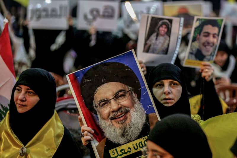 Pro-Iranian Hezbollah supporters attend a ceremony to mark al-Quds International Day in Beirut's southern suburb. Marwan Naamani/dpa