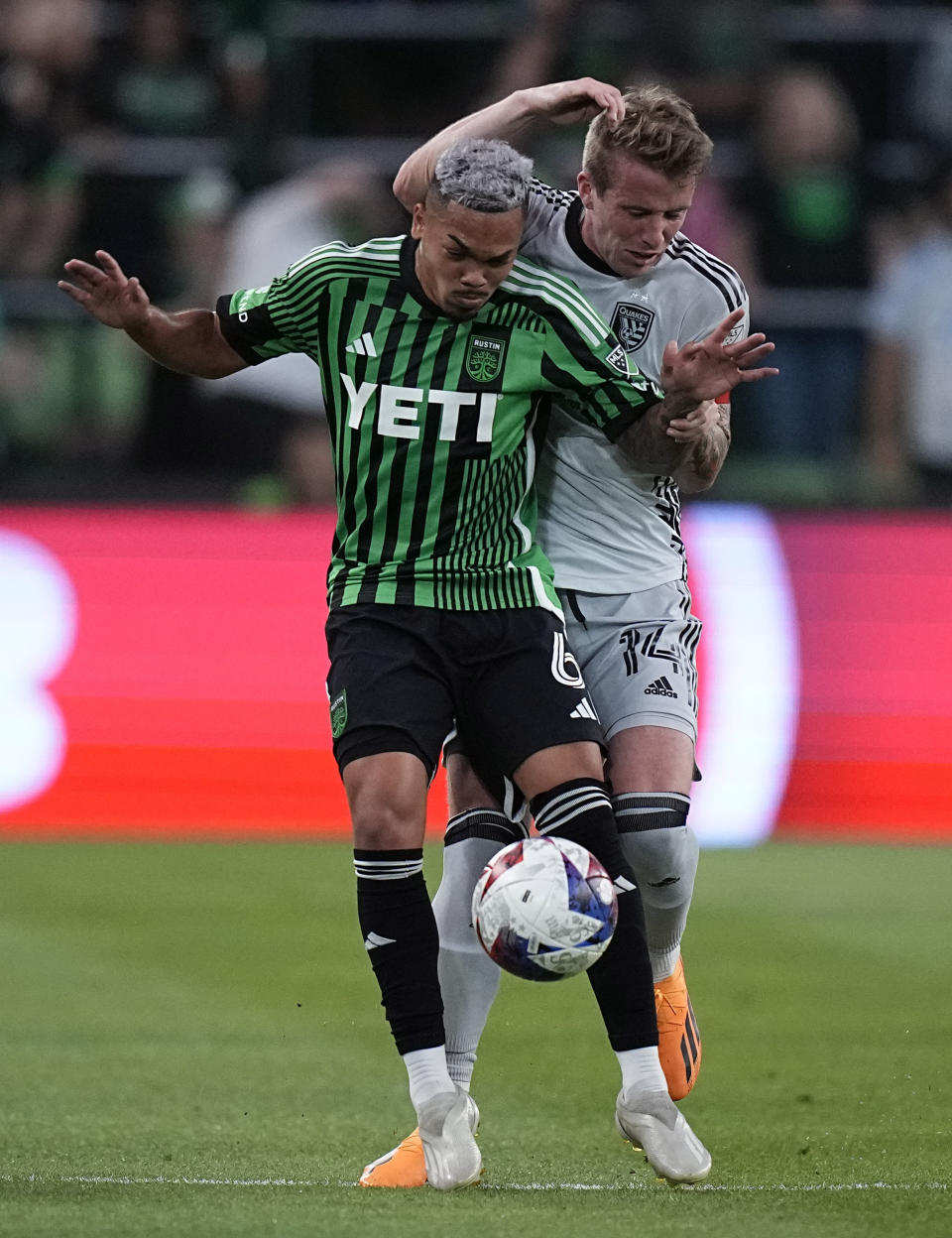 Austin FC midfielder Daniel Pereira (6) works the ball past San Jose Earthquakes midfielder Jackson Yueill (14) during the first half of an MLS soccer match in Austin, Texas, Saturday, April 29, 2023. (AP Photo/Eric Gay)