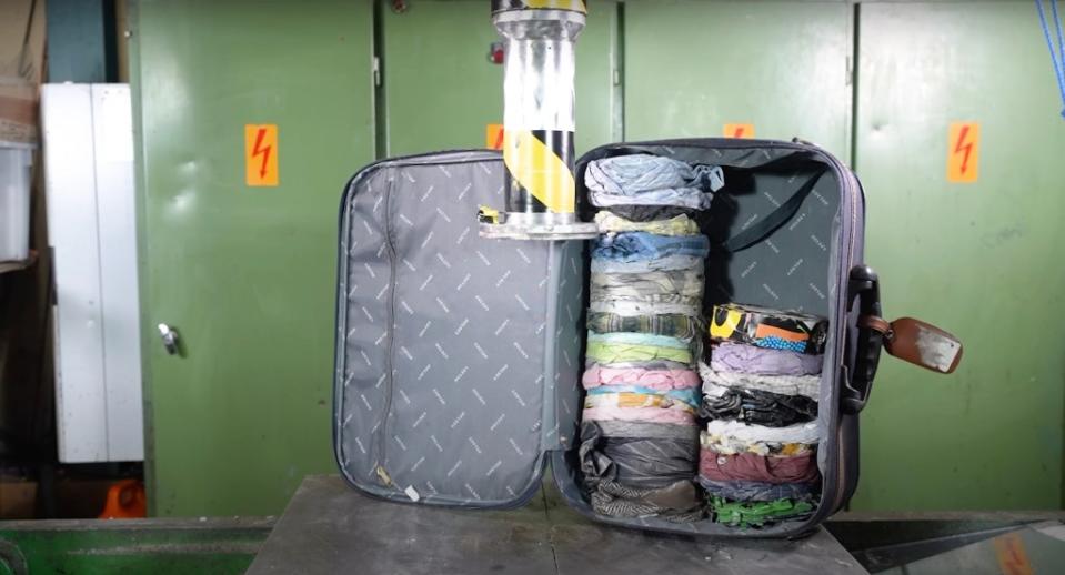 The flattened items were neatly stacked inside the baggage. YouTube/Hydraulic Press Channel