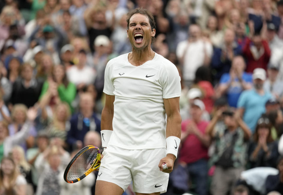 Spain's Rafael Nadal celebrates after beating Lithuania's Ricardas Berankis in a second round men's singles match on day four of the Wimbledon tennis championships in London, Thursday, June 30, 2022. (AP Photo/Kirsty Wigglesworth)