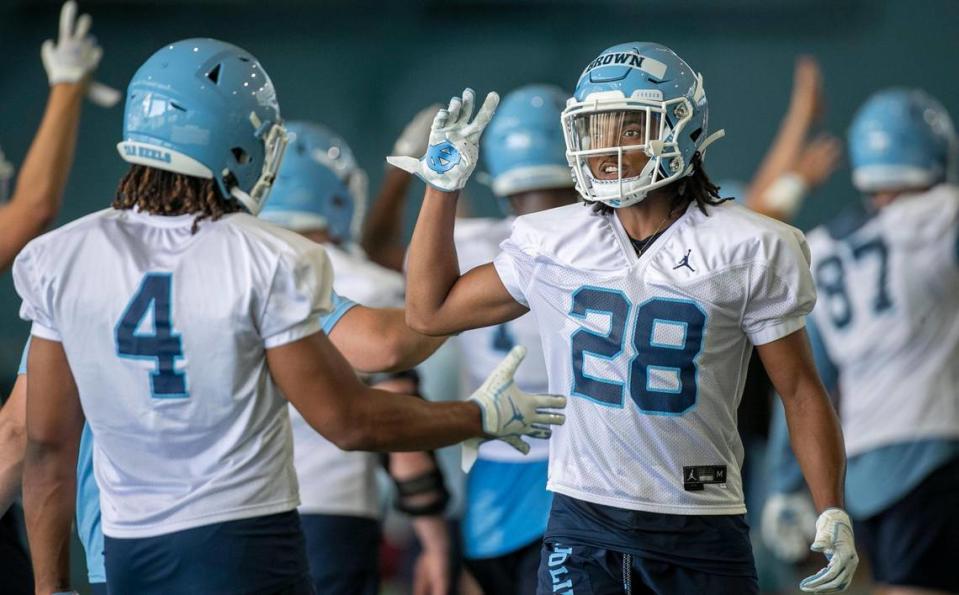 North Carolina defensive back Tymir Brown (28) and Trey Morrison (4) begin the final period of the Tar Heels’ practice on Thursday, August 5, 2021 in Chapel Hill N.C
