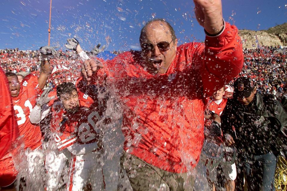 Wisconsin's coach Barry Alvarez celebrates a 21-20 victory against UCLA while being doused with ice water by his players Friday, Dec. 29, 2000, at the 67th annual Sun Bowl in El Paso, Texas.